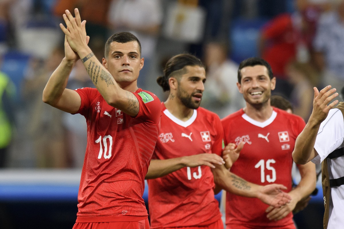 From left, Switzerland's midfielder Granit Xhaka, Switzerland's defender Ricardo Rodriguez and Switzerland's midfielder Blerim Dzemaili react after the FIFA World Cup 2018 group E preli ...