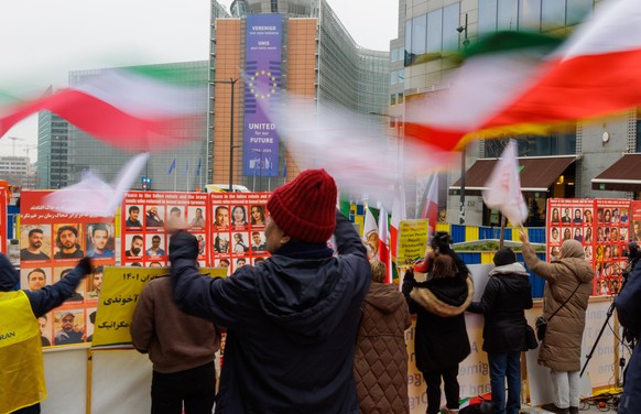 epa12690442 Supporters of the National Council of Resistance of Iran rally in Brussels to urge the EU to blacklist the Islamic Revolutionary Guard Corps RGC as a terrorist organization during a meetin ...