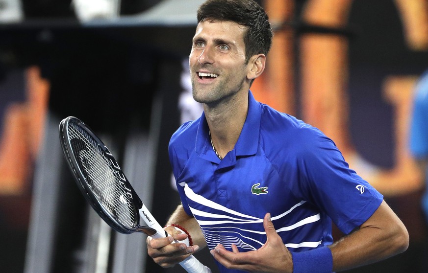 Serbia&#039;s Novak Djokovic celebrates after defeating France&#039;s Lucas Pouille in their semifinal at the Australian Open tennis championships in Melbourne, Australia, Friday, Jan. 25, 2019. (AP P ...