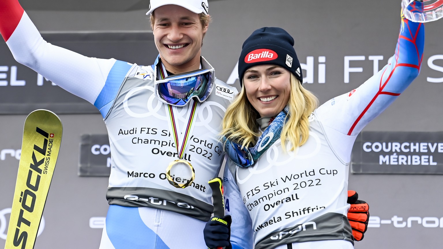 Marco Odermatt of Switzerland, left, winner of men&#039;s overall crystal globe trophy and Mikaela Shiffrin of the United States, right, winner the women&#039;s overall crystal globe trophy celebrate  ...