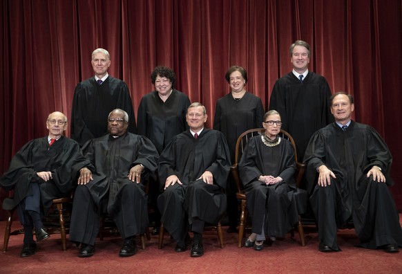 FILE - In this Nov. 30, 2018, file photo, tThe justices of the U.S. Supreme Court gather for a formal group portrait to include the new Associate Justice, top row, far right, at the Supreme Court Buil ...