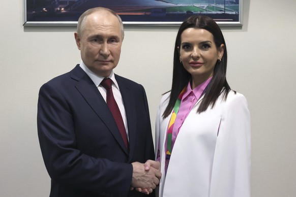 Russian President Vladimir Putin and Yevgenia Gutsul, the head of Moldova&#039;s autonomous region of Gagauzia, pose for a photo during the World Youth Festival at the Sirius Park of Science and Art o ...