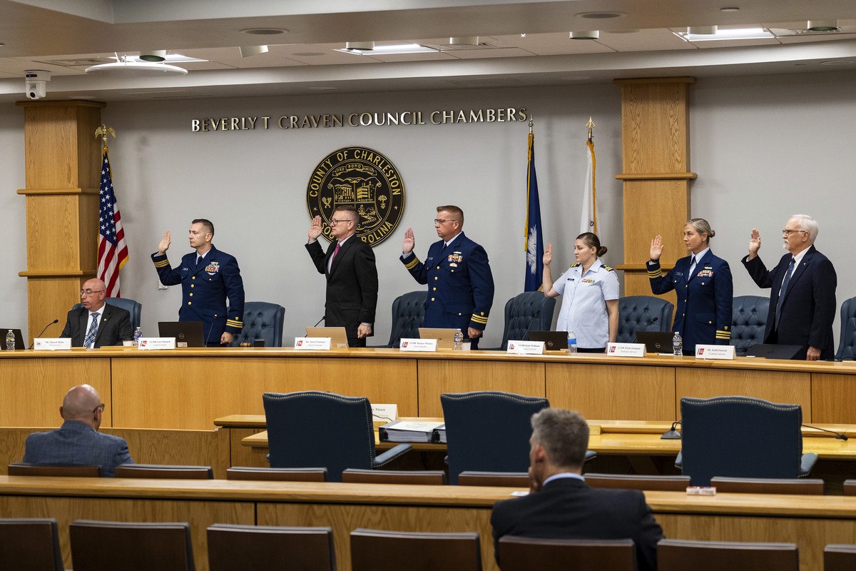 Coast Guard members of the investigative board for the Titan marine board formal hearing take an oath inside the Charleston County Council Chambers Monday, Sept. 16, 2024, in North Charleston, S.C. (A ...