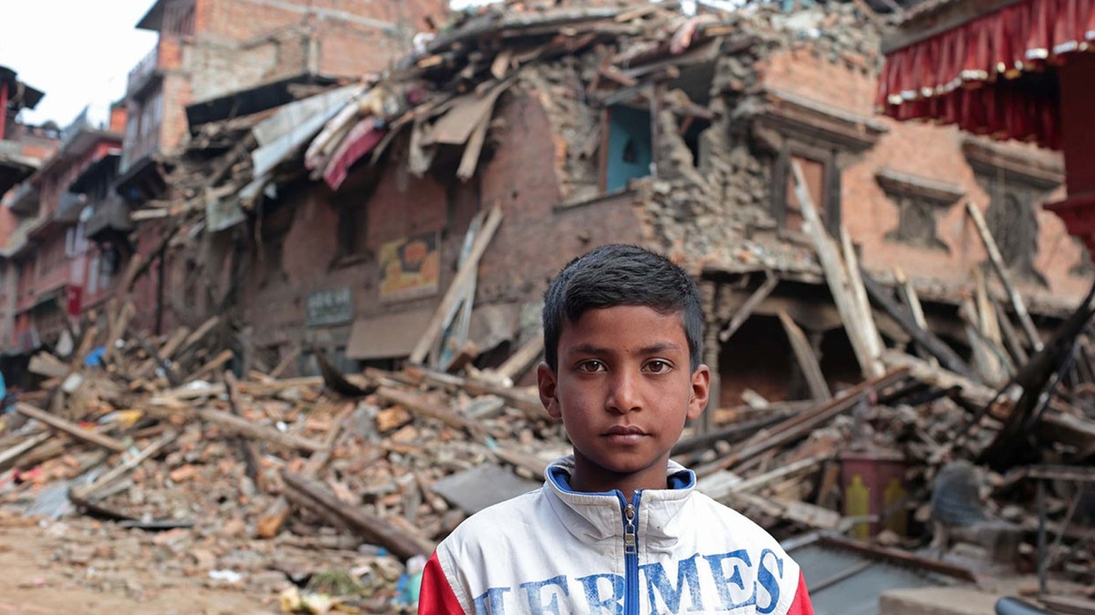 On 28 April, an 11-year-old boy stands in front of his destroyed home, in the city of Bhaktapur, Kathmandu Valley. Two of his relatives died in the massive earthquake.

On 29 April 2015 in Nepal, sear ...