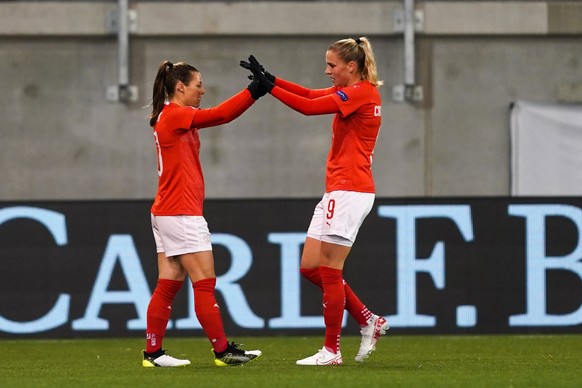 SCHAFFHAUSEN, SWITZERLAND - NOVEMBER 12: Ramona Bachmann of Switzerland and Ana-Maria Crnogorcevic of Switzerland celebrate her hat-trick during the UEFA EURO, EM, Europameisterschaft,Fussball Women s ...