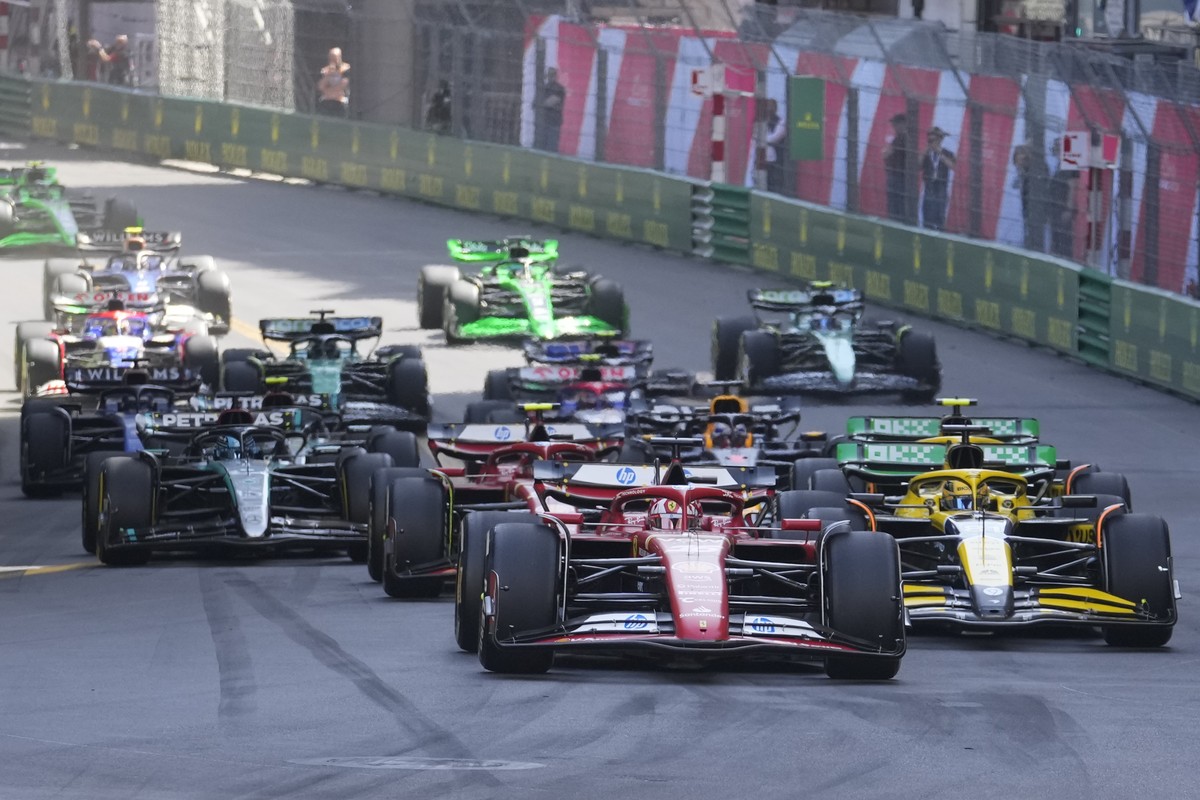 Ferrari driver Charles Leclerc of Monaco, centre, leads the field after the restart the Formula One Monaco Grand Prix race at the Monaco racetrack, in Monaco, Sunday, May 26, 2024. (AP Photo/Luca Brun ...