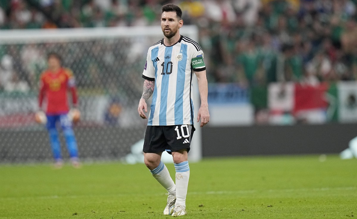 Argentina's Lionel Messi walks during the World Cup group C soccer match between Argentina and Mexico, at the Lusail Stadium in Lusail, Qatar, Saturday, Nov. 26, 2022. (AP Photo/Ariel Schalit)