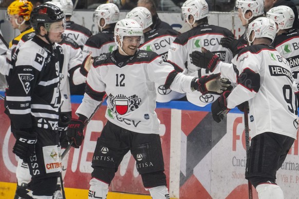Yannick Zehnder (LHC), left, and Fabian Heldner (LHC), right, celebrates the 0 - 3 goal, during the regular season of National League Swiss Championship 2025/26 between HC Lugano and Lausanne HC at th ...