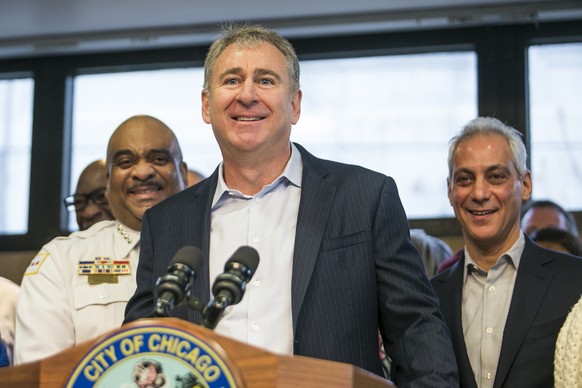 FILE - Chicago Police Supt. Eddie Johnson, left, and Mayor Rahm Emanuel, right, look on as Chicago billionaire Ken Griffin discusses a $10 million donation to reduce gun violence in the city during a  ...