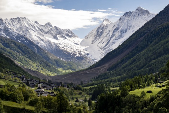 epa12142509 A general view, with the village of Kippel in the foreground, after a massive avalanche triggered by the collapse of the Birch Glacier nearly destroyed the village of Blatten, Switzerland, ...