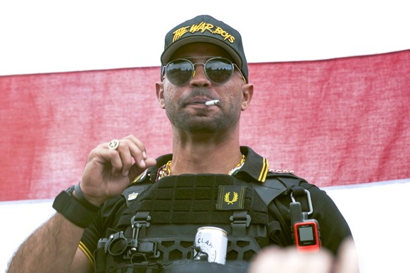 FILE - In this Sept. 26, 2020, file photo, Proud Boys leader Henry &quot;Enrique&quot; Tarrio wears a hat that says The War Boys during a rally in Portland, Ore. The leader of the far-right Proud Boys ...
