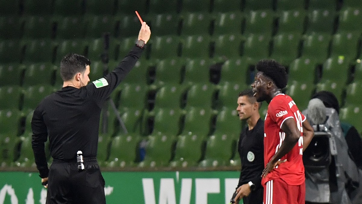 Referee Harm Osmers shows the red card to Bayern's Alphonso Davies during the German Bundesliga soccer match between Werder Bremen and Bayern Munich in Bremen, Germany, Tuesday, June 16, 2020. Be ...