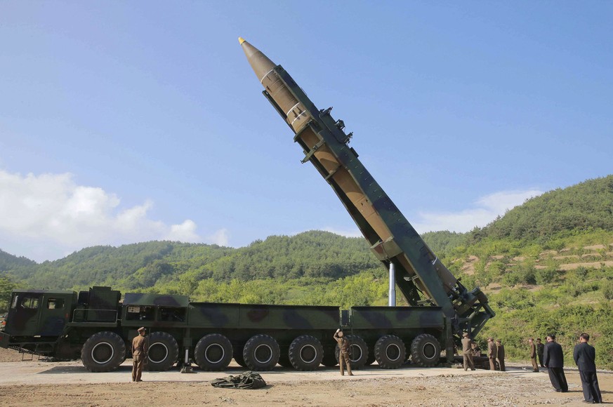 FILE - In this July 4, 2017, file photo distributed by the North Korean government, North Korean leader Kim Jong Un, second from right, inspects the preparation of the launch of a Hwasong-14 intercont ...
