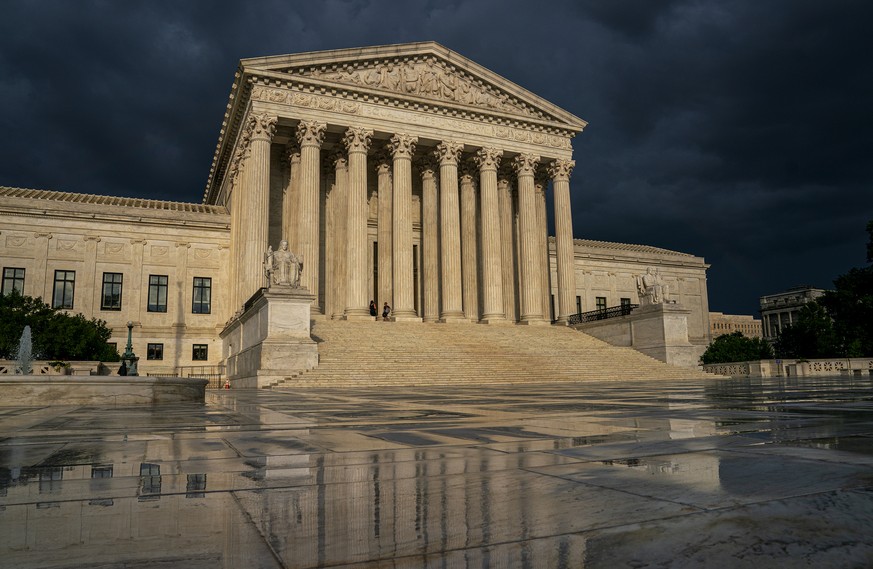 FILE - In this June 20, 2019 file photo, the Supreme Court is seen under stormy skies in Washington. Two issues that could determine the distribution of political power for the next decade await resol ...