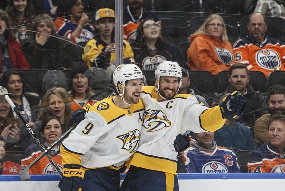 Nashville Predators&#039; Filip Forsberg (9) and Roman Josi (59) celebrate a goal during first period NHL hockey action against the Edmonton Oilers in Edmonton, Alberta, Tuesday, Jan. 14, 2019. (Jason ...