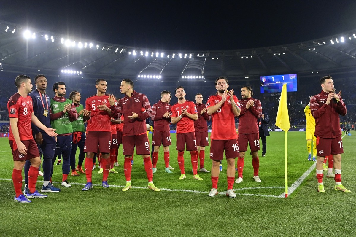 Switzerland's players cheer after the 2022 FIFA World Cup European Qualifying Group C match between Italy and Switzerland at the Stadio Olimpico in Rome, Italy, Friday, November 12, 2021.