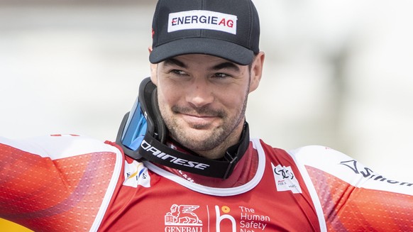 epa09828738 First placed Vincent Kriechmayr of Austria celebrates on the podium for the men&#039;s downhill race at the FIS Alpine Skiing World Cup final in Courchevel, France, 16 March 2022. EPA/URS  ...