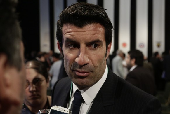 Portugal&#039;s Figo talks to reporters after attending the CONMEBOL general congress in Asuncion, Paraguay, Wednesday, March 4, 2015. The former Portugal, Barcelona and Real Madrid playmaker entered  ...