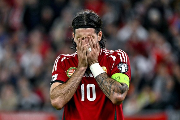 epa12447308 Dominik Szoboszlai (L) of Hungary covers his face during the 2026 FIFA World Cup European Qualifiers Group F soccer match between Hungary and Armenia, in Budapest, Hungary, 11 October 2025 ...