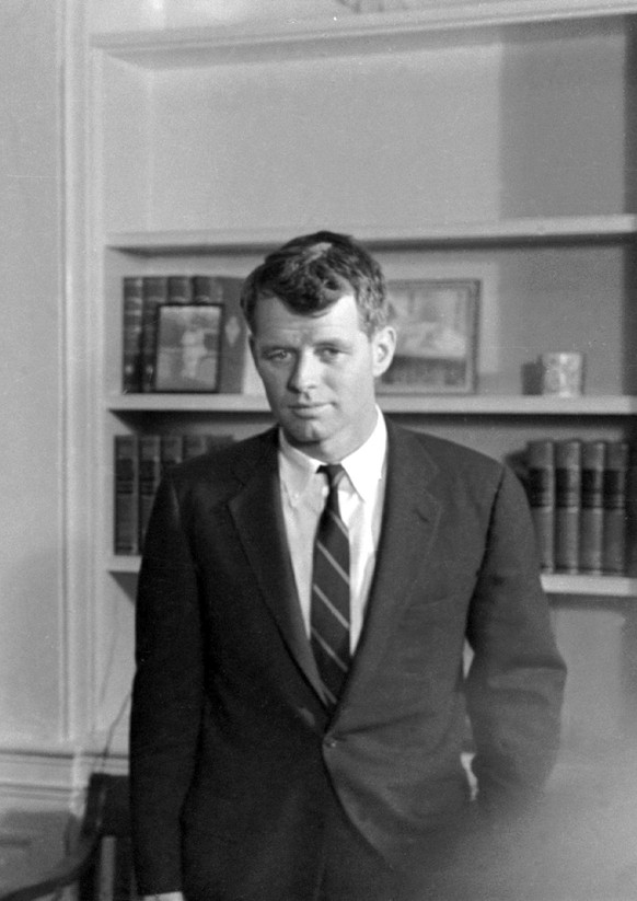 FILE - FBI Director J. Edgar Hoover speaks to President John F. Kennedy and his brother, Attorney General Robert Kennedy, during a White House conference, Feb. 23, 1961. The assassination of John F. K ...