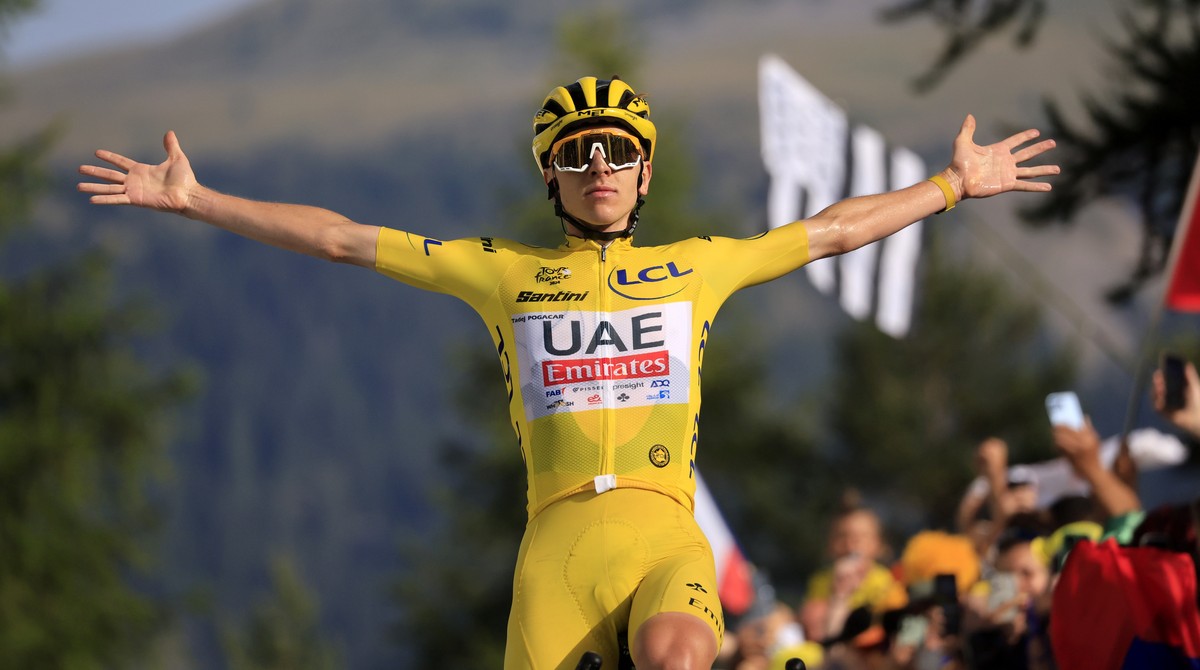 epa11489396 Yellow jersey Slovenian rider Tadej Pogacar of UAE Team Emirates celebrates as he crosses the finish line and winning the 20th stage of the 2024 Tour de France cycling race over 132km from ...