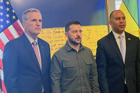 In this photo provided to the Associated Press, Ukrainian President Volodymyr Zelenskyy, center, poses for a photo with House Speaker Kevin McCarthy of Calif., left, and House Minority Leader Hakeem J ...