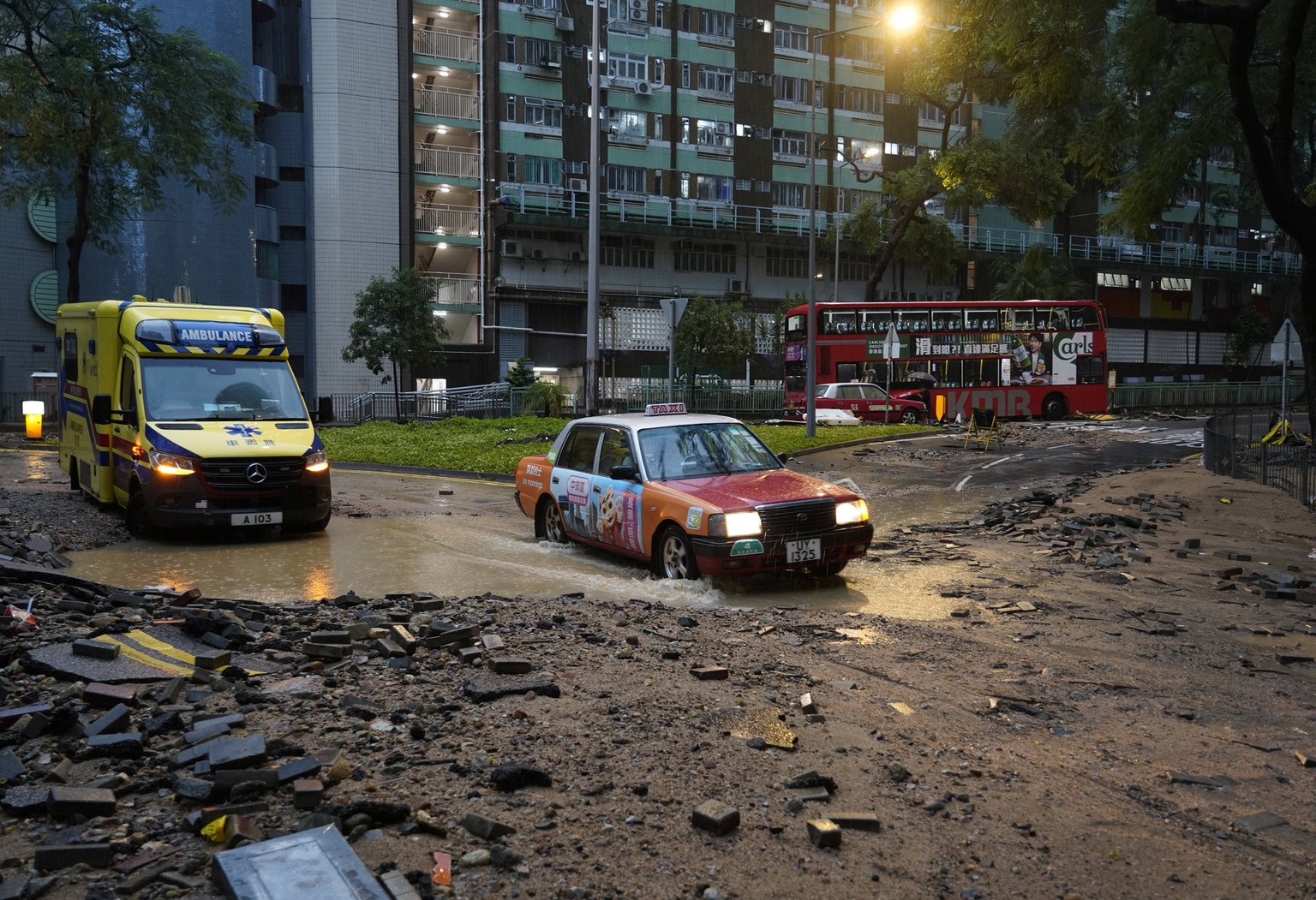 HONG KONG, CHINA - SEPTEMBER 08: Cars drive on a waterlogged road near Chai Wan station on September 8, 2023 in Hong Kong, China. Torrential downpours hit Hong Kong on the night of September 7 and cau ...