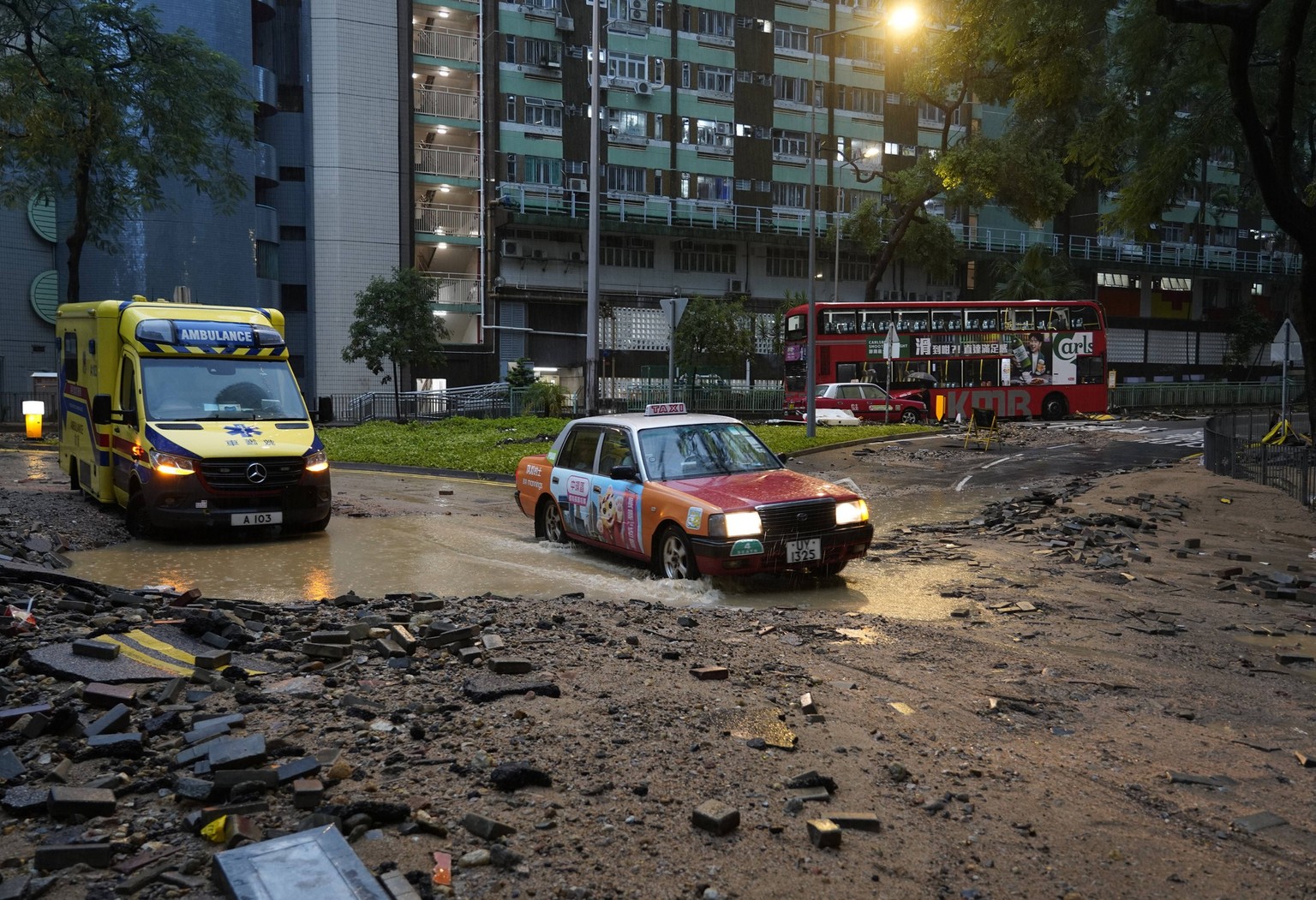 HONG KONG, CHINA - SEPTEMBER 08: Cars drive on a waterlogged road near Chai Wan station on September 08, 2023 in Hong Kong, China.  Torrential rains hit Hong Kong on the night of Sept. 7, causing…