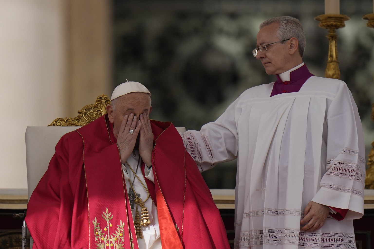 Pope Francis rubs his eyes before the start of the Palm Sunday mass in St. Peter&#039;s Square at the Vatican, Sunday, March 24, 2024. (AP Photo/Alessandra Tarantino)