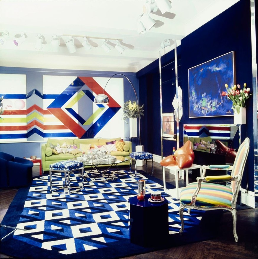 The living room of Mr and Mrs Steven Jacobson's New York apartment, decorated by Richard Ohrbach. The rear wall is covered by a transparent geometric graphic by Richard Ohrbach. Beneath it is a l ...