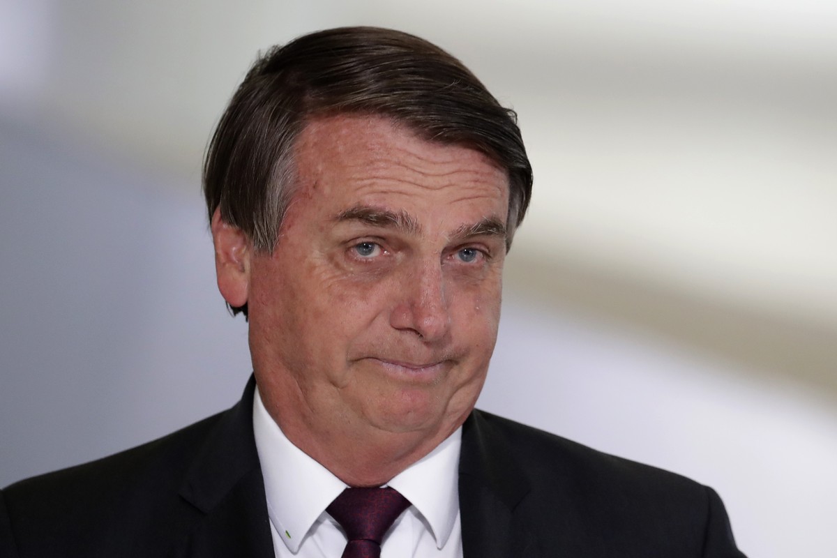 Brazil's President Jair Bolsonaro for a ceremony on digital social savings and the payment of aid to families amid the COVID-19 pandemic, in Brasilia, Brazil, Wednesday, Nov. 4, 2020. (AP Photo/E ...