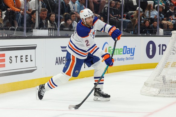 Edmonton Oilers defenseman Evan Bouchard (2) passes the puck against the Utah Mammoth during the second period of an NHL hockey game, Tuesday, March 24, 2026, in Salt Lake City. (AP Photo/Melissa Majc ...