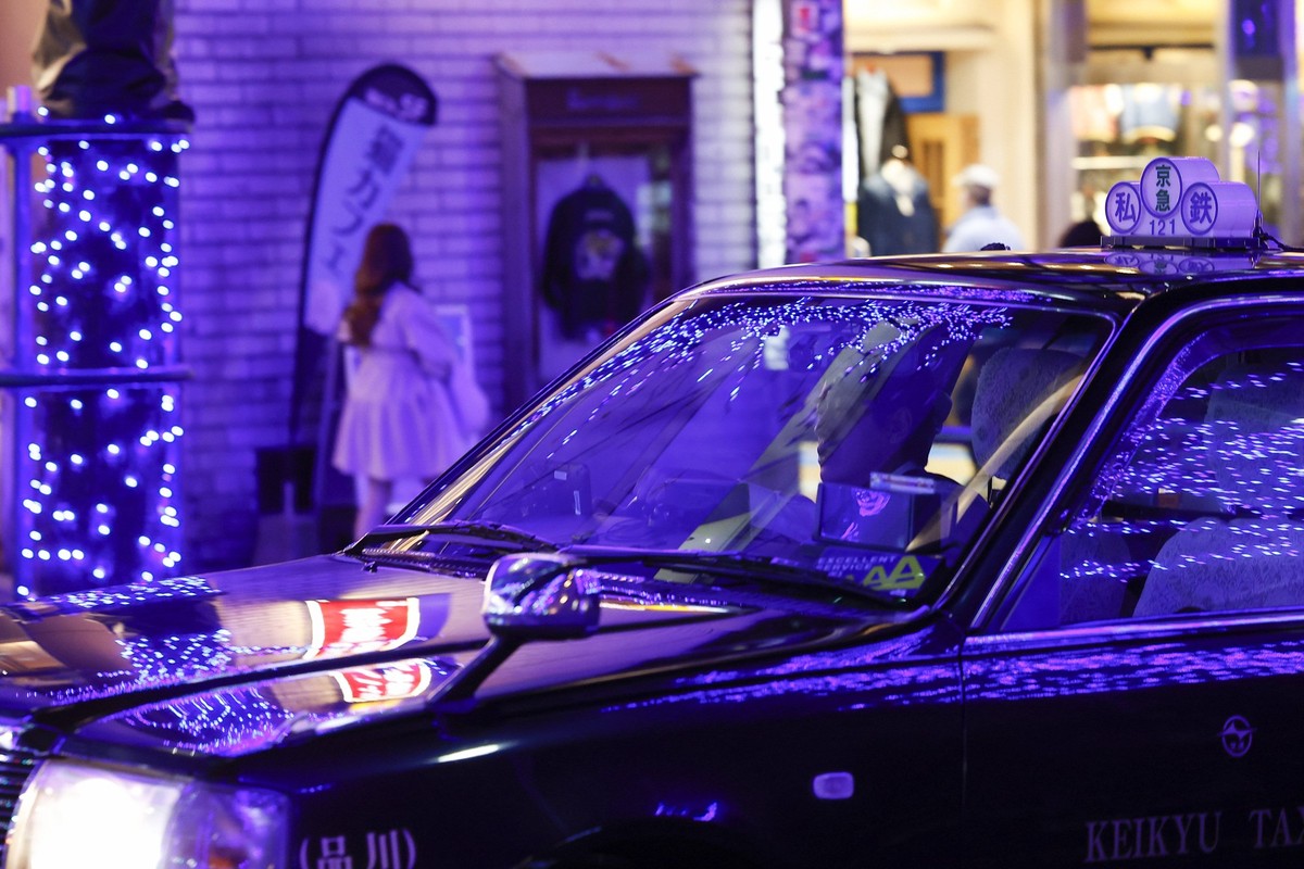 A taxi driver drives under blue LED lights displayed along the streets of the Shibuya area as part of the Blue Cave Illumination 2024 event on December 6, 2024, in Tokyo, Japan. Thousands of blue LED  ...