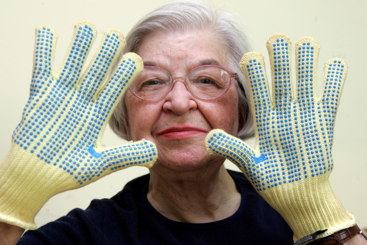 FILE - Stephanie Kwolek, 83, shown in this June 20, 2007 file photo taken in Brandywine Hundred, Del., she wears regular house gloves made with the Kevlar she invented. Her friend, Rita Vasta, told Th ...