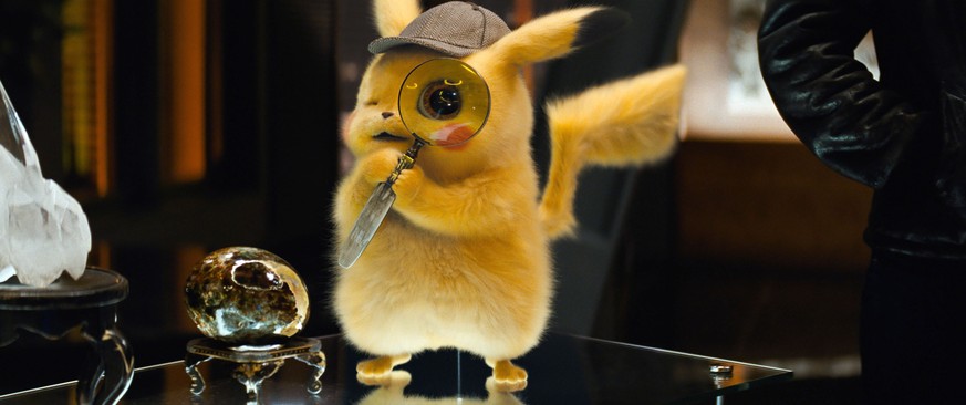 This image released by Warner Bros. Pictures shows the character Detective Pikachu, voiced by Ryan Reynolds, in a scene from &quot;Pokemon Detective Pikachu.&quot; (Warner Bros. Pictures via AP)