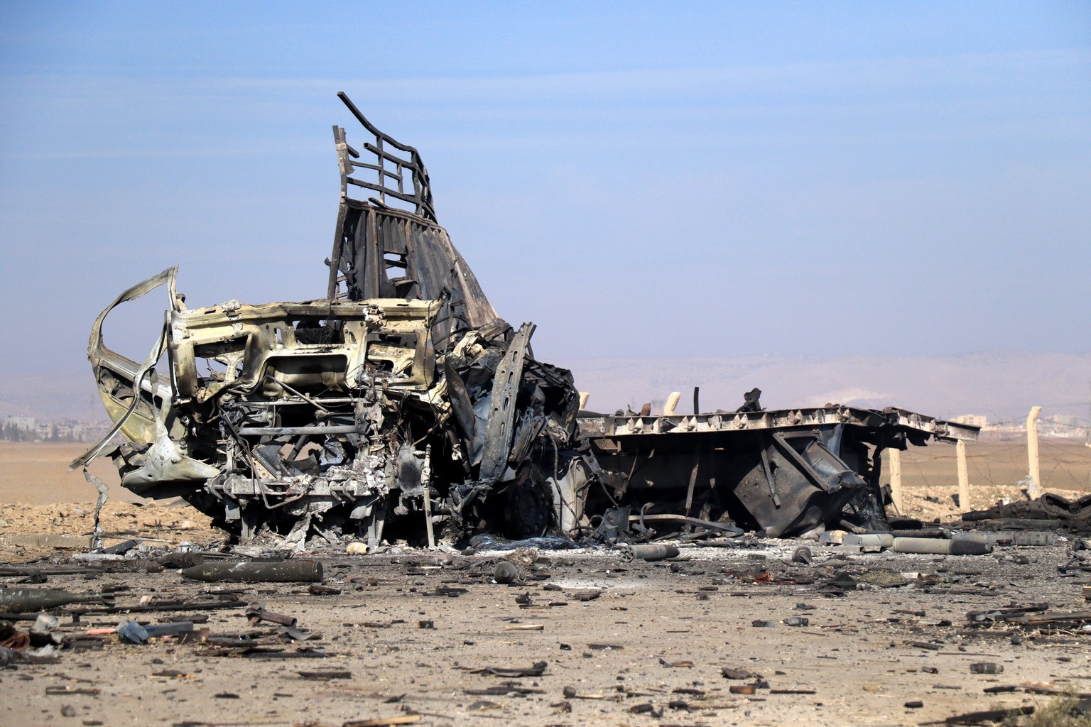 epa11770323 A destroyed truck after a Turkish airstrike near Qamishli, northeast of Syria on 11 December 2024. A Turkish security source said on 10 December 2024 that Turkey destroyed 12 trucks loaded ...