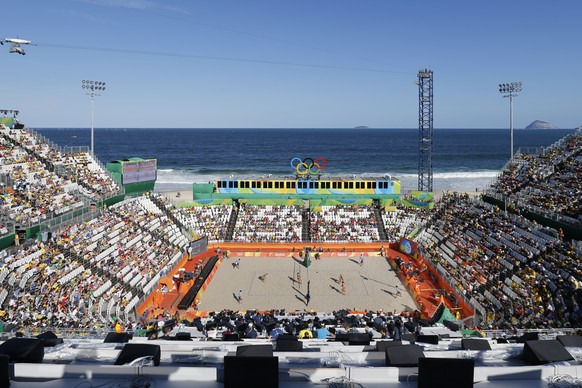 Switzerland&#039;s Anouk Verge-Depre and Isabelle Forrer, right, in action during the women&#039;s Round of 16 beach volleyball match against Germany&#039;s Laura Ludwig and Kira Walkenhorst in the Be ...
