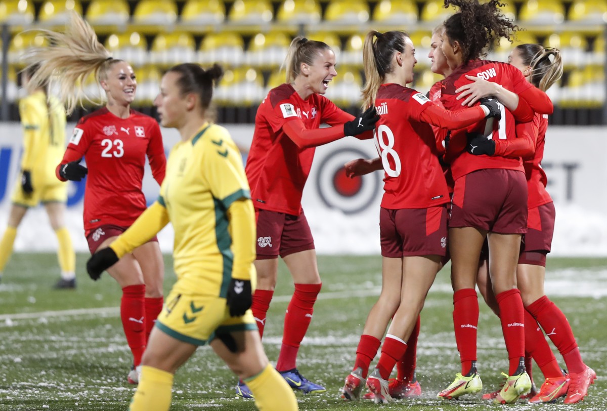 Switzerland's team players celebrate after an own goal by Lithuania's Monika Piesliakaite during the Women's World Cup 2023 Group G qualifying soccer match between Lithuania and Switzer ...