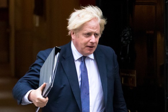 epa09418764 British Prime Minister Boris Johnson departs 10 Downing Street in London, Britain, 18 August 2021. Prime Minister Boris Johnson has recalled parliament from recess to discuss the ongoing s ...