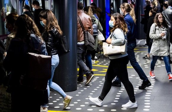 epa08414947 Commuters wait for a metro at the metro m2 station and train CFF/SBB station during the spread of the pandemic Coronavirus (COVID-19) disease in Lausanne, Switzerland, Monday, May 11, 2020 ...