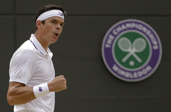 Canada&#039;s Milos Raonic reacts after winning a point against Spain&#039;s Albert Ramos-Vinolas during their Men&#039;s Singles Match on day six at the Wimbledon Tennis Championships in London Satur ...