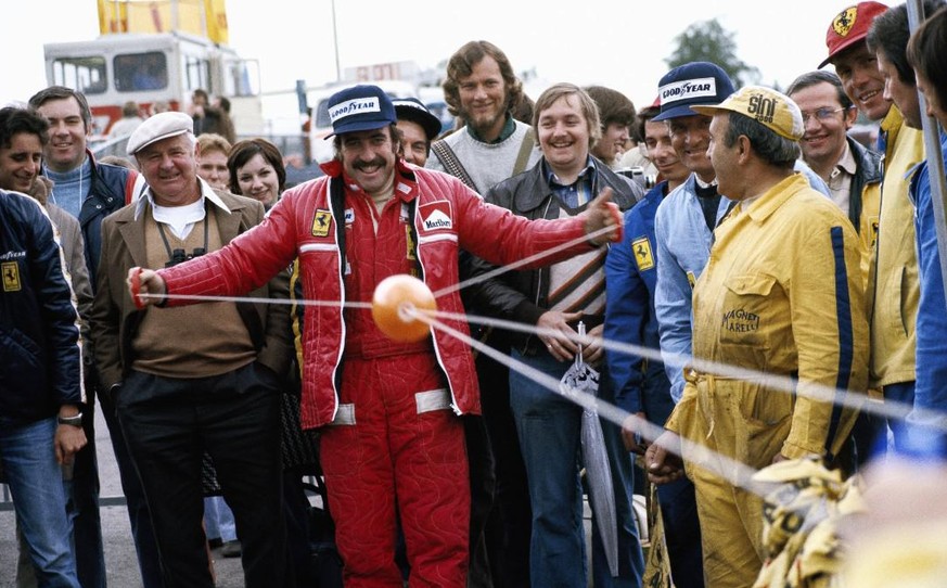 IMAGO / Motorsport Images

1975 Belgian GP ZOLDER, BELGIUM - MAY 25: Clay Regazzoni plays a game with his mechanics during the Belgian GP at Zolder on May 25, 1975 in Zolder, Belgium. PUBLICATIONxINxG ...