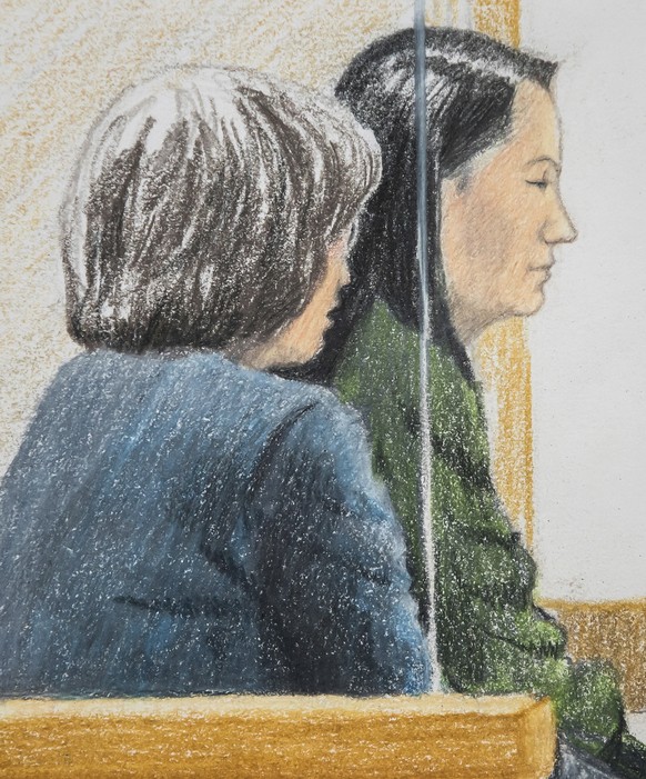In this courtroom sketch, Meng Wanzhou, right, the chief financial officer of Huawei Technologies, sits beside a translator during a bail hearing at British Columbia Supreme Court in Vancouver, on Fri ...