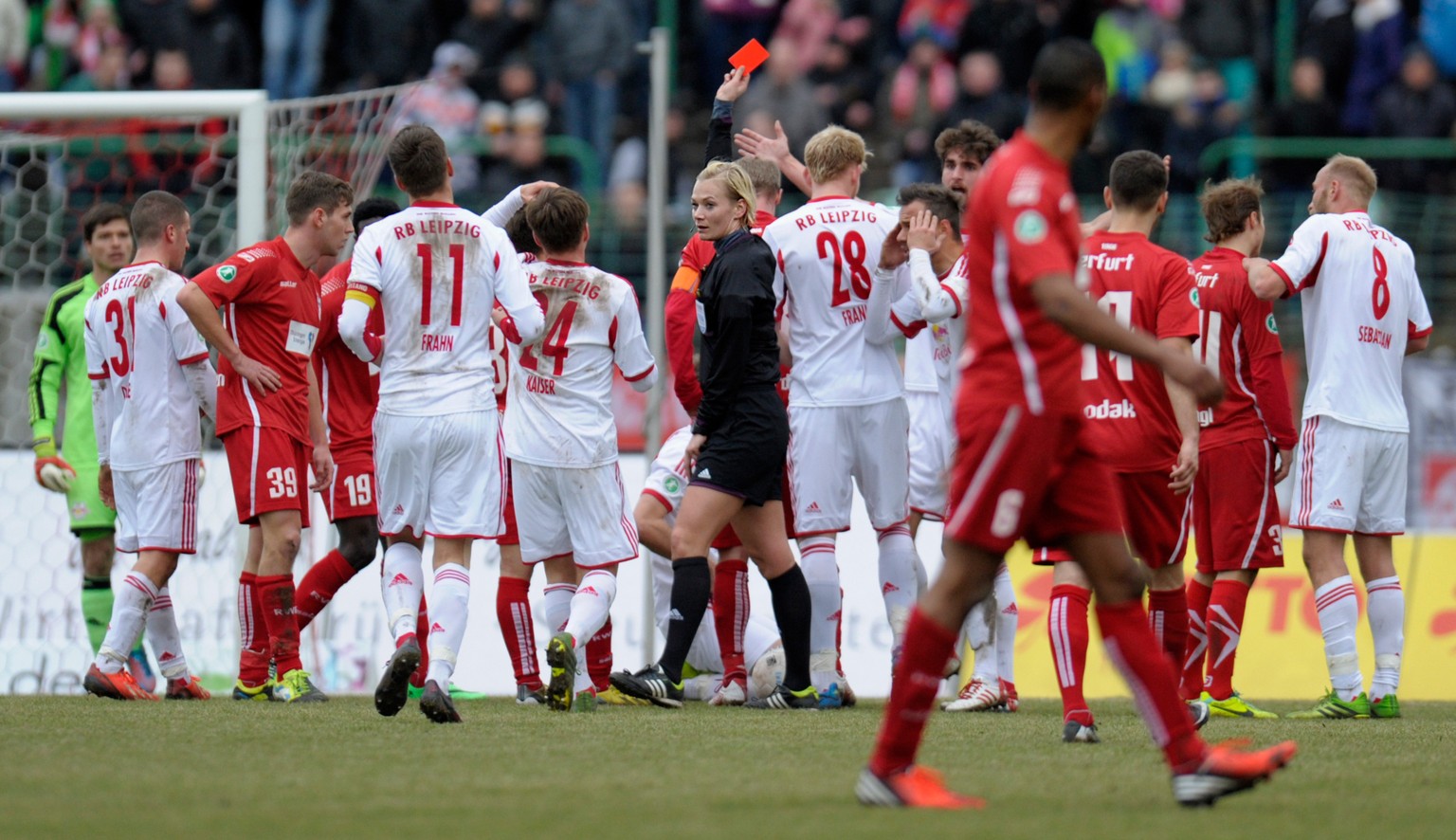 ERFURT, GERMANY - FEBRUARY 08: Referee Bibiana Steinhaus shows the red card to Tobias Willers during the Third leaguematch between Rot-Weiss Erfurt and RB Leipzig at Steigerwald stadium on February 8, ...