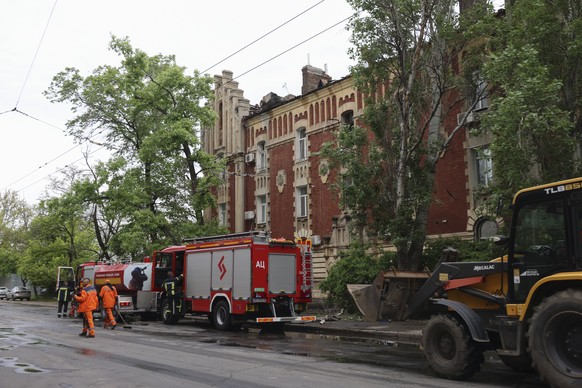 epa12970045 Ukrainian rescuers work at the site of the Russian strike on the residential area in Odesa, Ukraine, 18 May 2026, amid the Russian invasion. At least two people were injured after an overn ...