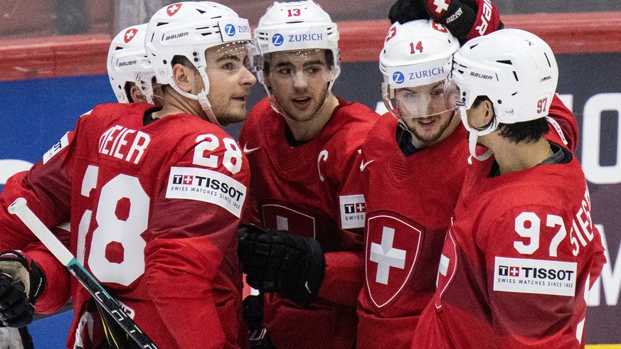Switzerland&#039;s Timo Meier, Nico Hischier, Dean Kukan and Jonas Siegenthaler, from left, celebrate their fifth goal during the Ice Hockey World Championship group A preliminary round match between  ...