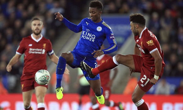 Leicester City&#039;s Demarai Gray, centre, and Liverpool&#039;s Alex Oxlade-Chamberlain, right, challenge for the ball during their English League Cup, third round soccer match Leicester against Live ...