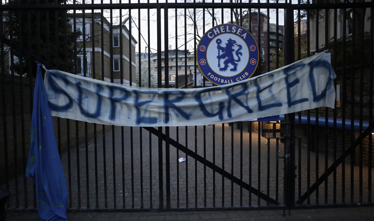A banner hangs from one of the gates of Stamford Bridge stadium in London where Chelsea fans were protesting against Chelsea's decision to be included amongst the clubs attempting to form a new E ...