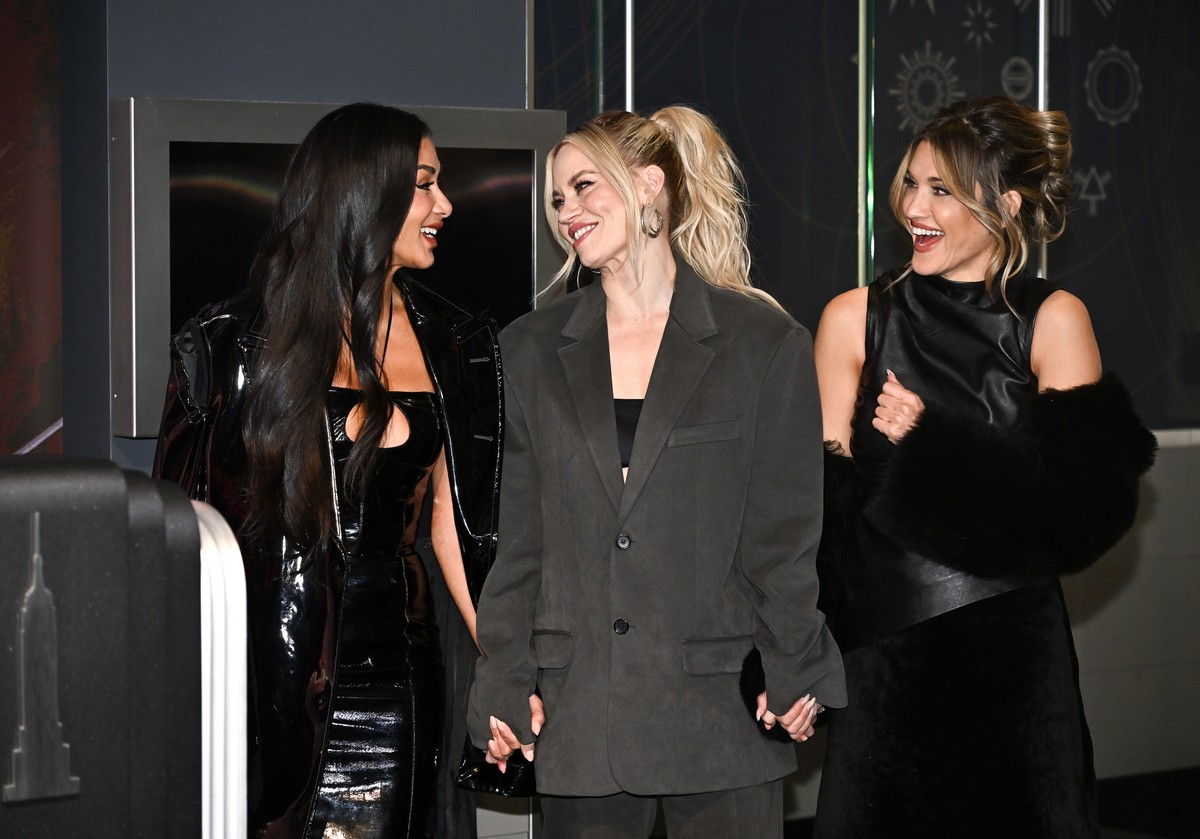 Nicole Scherzinger, left, Kimberly Wyatt and Ashley Roberts of the Pussycat Dolls participate in the ceremonial lighting of the Empire State Building in celebration of their global reunion "PCD F ...