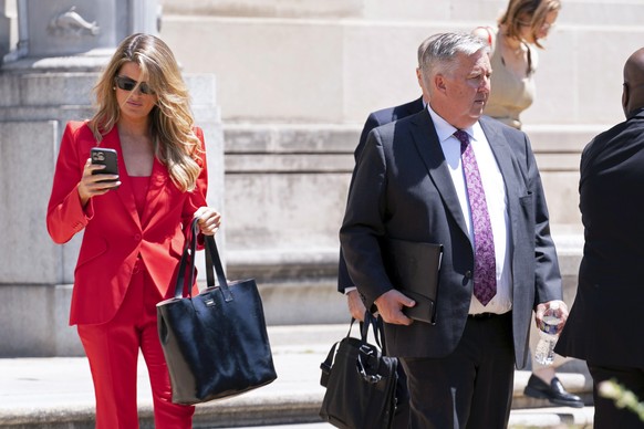 Donald Trump attorneys James Trusty, right and Lindsey Halligan, leave the Department of Justice in Washington, Monday, June 5, 2023. (AP Photo/Jose Luis Magana)
James Trusty,Lindsey Halligan